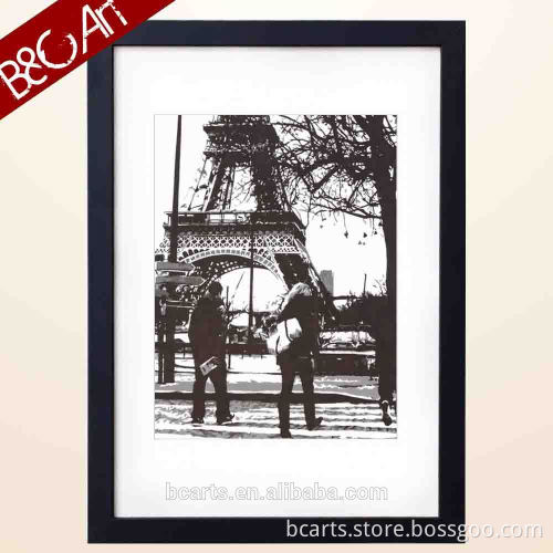 Men in front of famous Paris eiffel tower painting